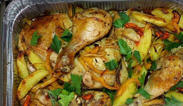Chicken with potatoes and vegetables in the oven