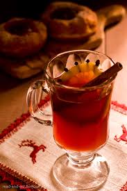 Hot port wine with black leaves and orange