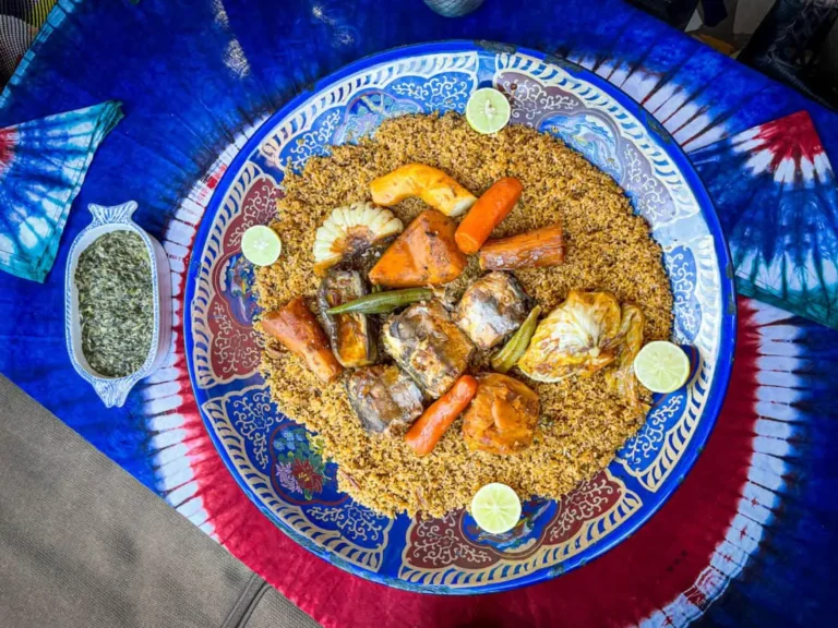 Is Gambian cuisine influenced by other cultures?