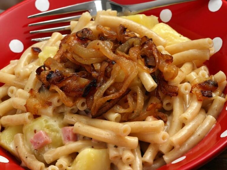 How does Swiss cuisine differ from neighboring European cuisines?