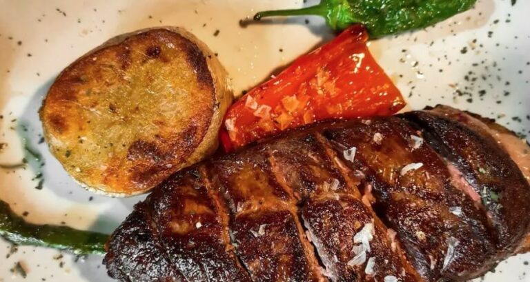 How is Andorran cuisine influenced by neighboring countries?