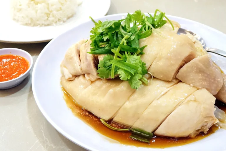 What are some famous Singaporean sauces or condiments used in dishes?
