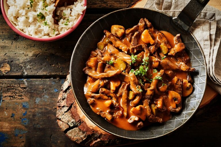 What are the staple ingredients used in Swiss cooking?