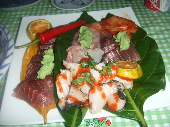 Can you tell me about the influence of Palauan cultural traditions on the cuisine?