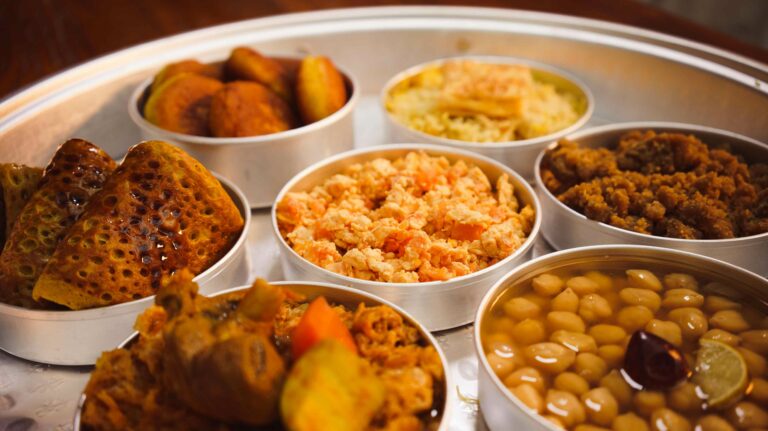 How is Emirati cuisine influenced by the Bedouin culture and lifestyle?