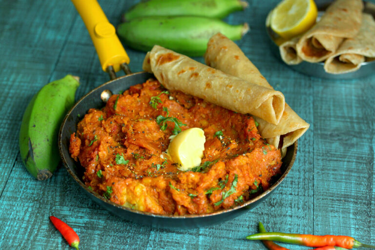 What are the common seasonings and spices used in Ugandan cuisine?