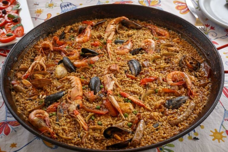 What are the key flavors and ingredients used in Spanish cuisine?
