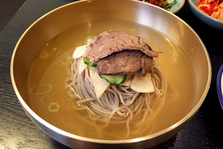 How has the political situation influenced the availability of ingredients in North Korean cuisine?