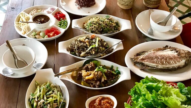 Is there a focus on communal dining and sharing meals in Laotian culture?