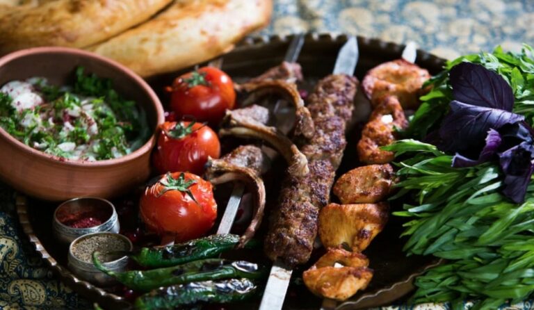 How is Azerbaijani cuisine influenced by neighboring countries?