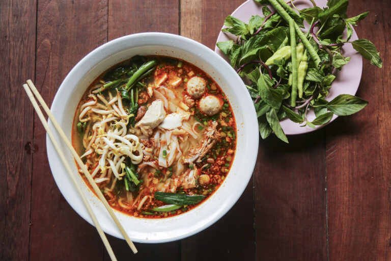 Can you find any influences from Laotian ethnic groups or cultural traditions in the cuisine?