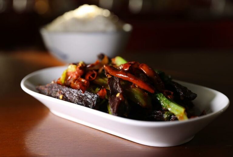 What are some popular Bhutanese dishes made with local ingredients?