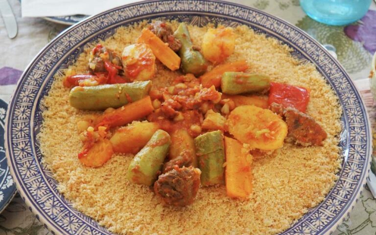 What are the common seasonings and spices used in Tunisian cuisine?