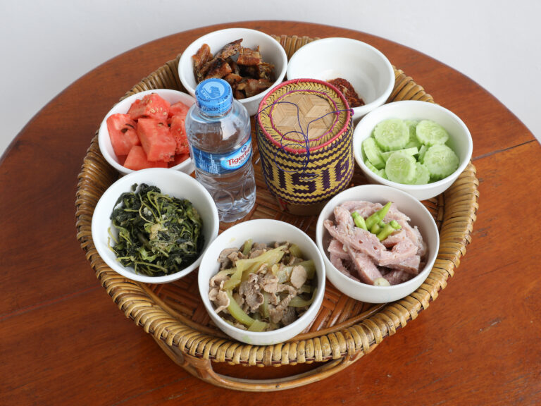 What is Laotian cuisine known for?