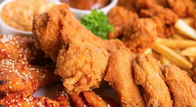 Are there any specific cooking techniques used in Bahamian cuisine?