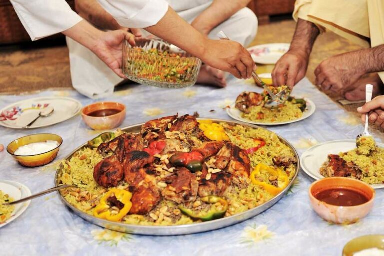 How has the country’s coastal location influenced Omani cuisine?