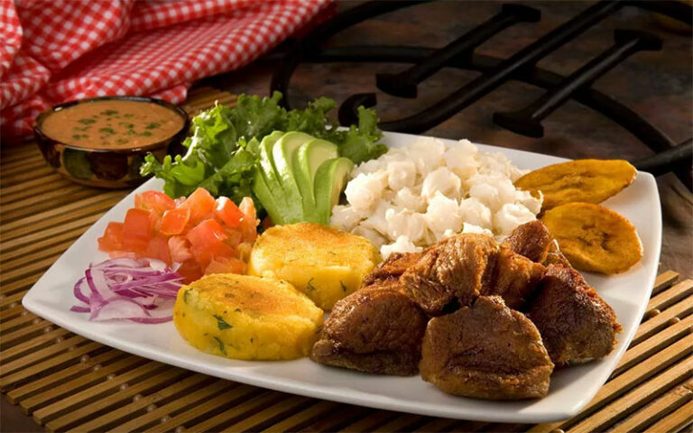 Can you recommend some local markets or food stalls to experience authentic Ecuadorian flavors?