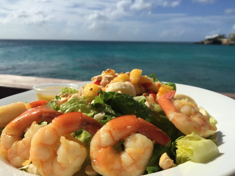 What are the main meat dishes in Antiguan and Barbudan cuisine?
