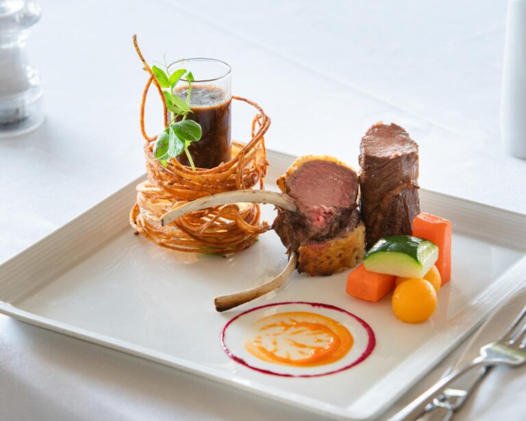 What are the staple ingredients in Grenadian meals?