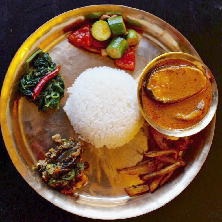Are there any unique dining customs or etiquette in Nepal?