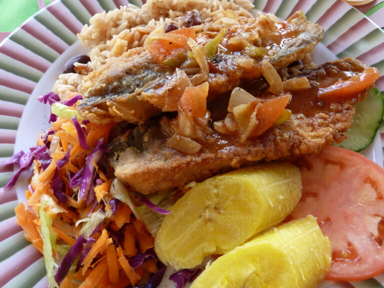 Can you recommend some typical dishes from Antigua and Barbuda for a first-time visitor?