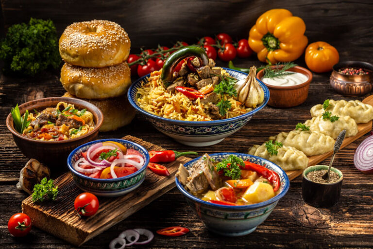 Are there any Uzbek dishes influenced by neighboring countries like Tajikistan or Kazakhstan?