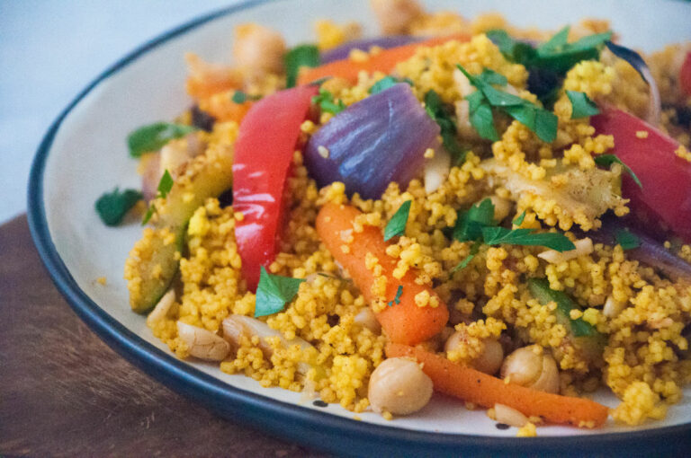 What is the significance of couscous in Tunisian cuisine?
