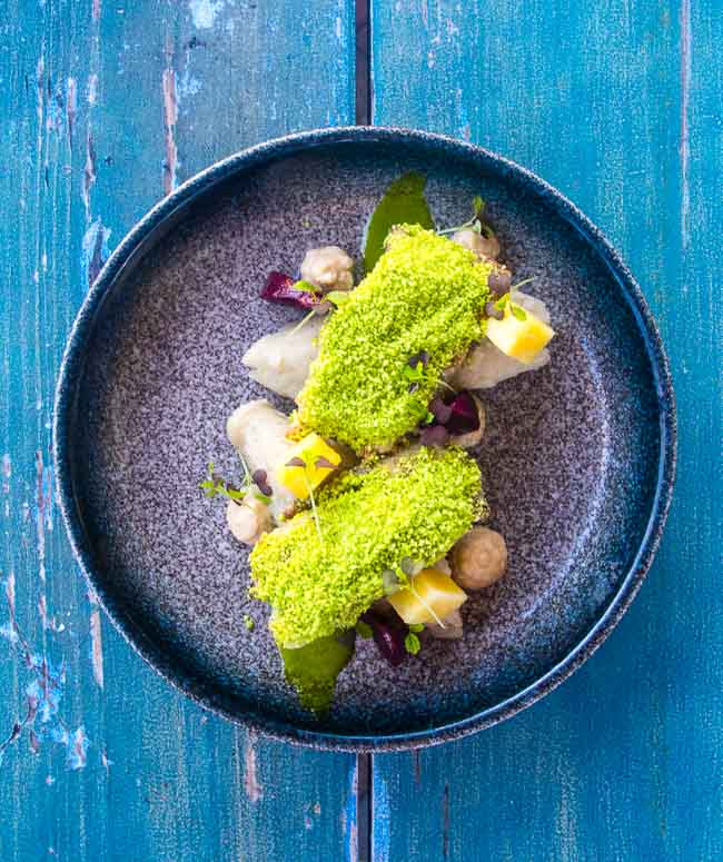 What are some local ingredients commonly used in Barbadian cuisine?