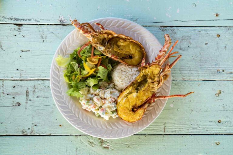 How is Barbadian cuisine influenced by other cultures?