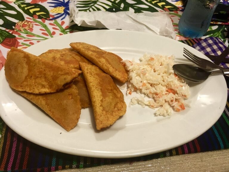 What are the typical ingredients in Belizean salads?