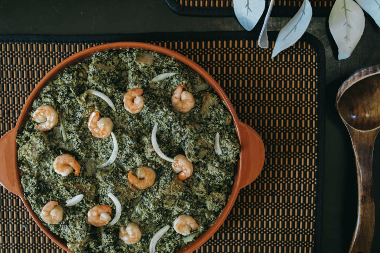 What are some traditional herbs and spices used in Cameroonian cuisine?