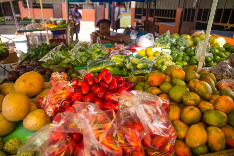 Can you tell me about the use of local fruits, vegetables, and spices in Saint Lucian cooking?