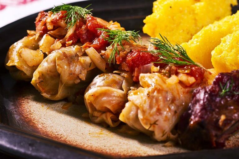 Can you tell me about the use of sour cream, cheese, and cabbage in Romanian cooking?