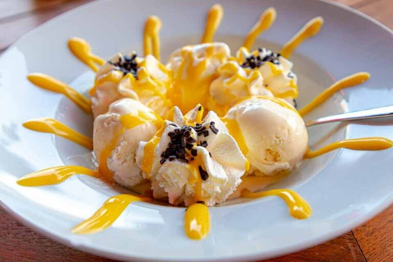 What are some local ingredients commonly used in Belgian cuisine?