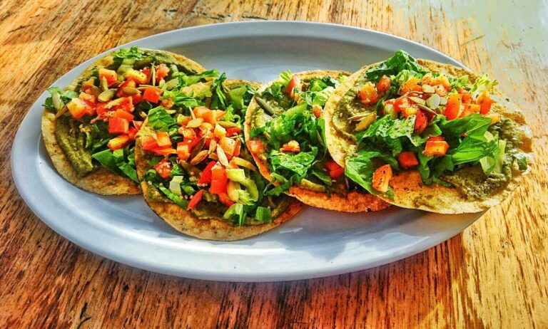What are some local ingredients commonly used in Belizean cuisine?