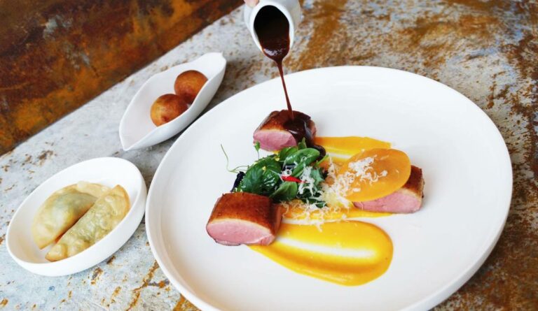Can you find traditional Monégasque food in restaurants or only at home?
