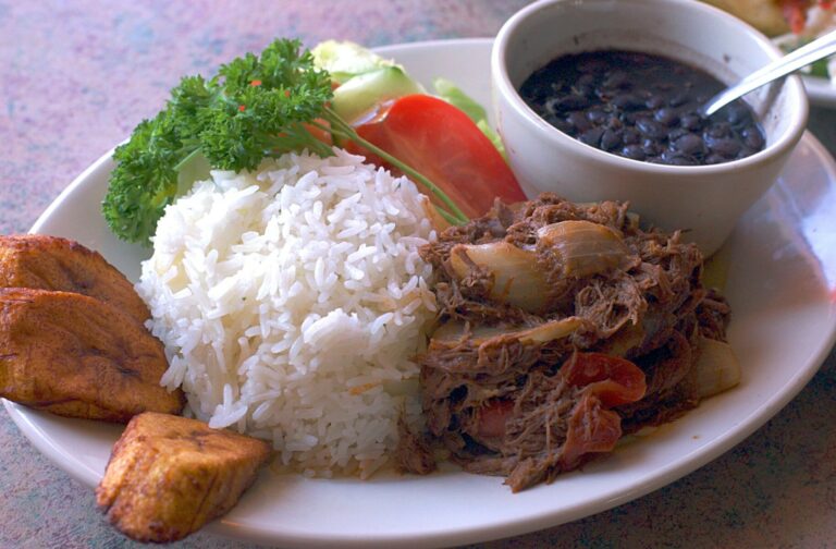 How does Cuban cuisine differ from other Caribbean cuisines?