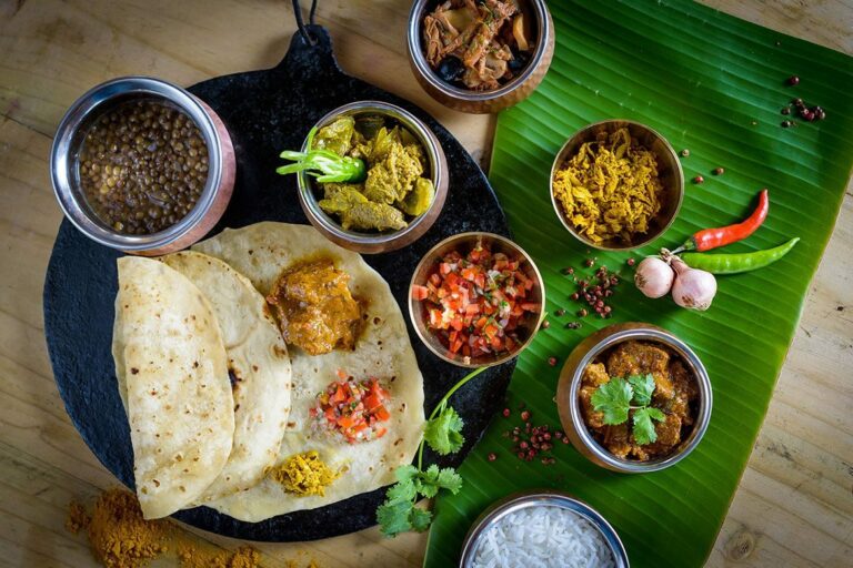 How is Mauritian food influenced by its history and multicultural society?