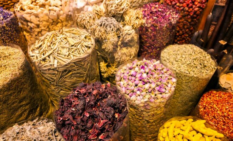 What are some common spices and herbs used in Qatari cooking?