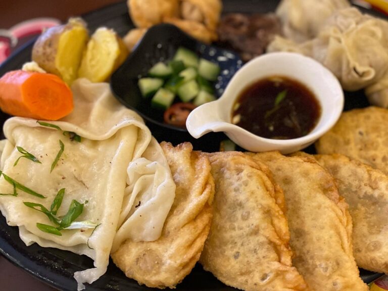 How can I experience an authentic Mongolian dining experience?