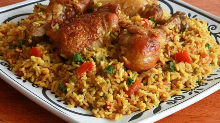 Can you tell me about the use of rice, dates, and camel meat in Qatari cooking?