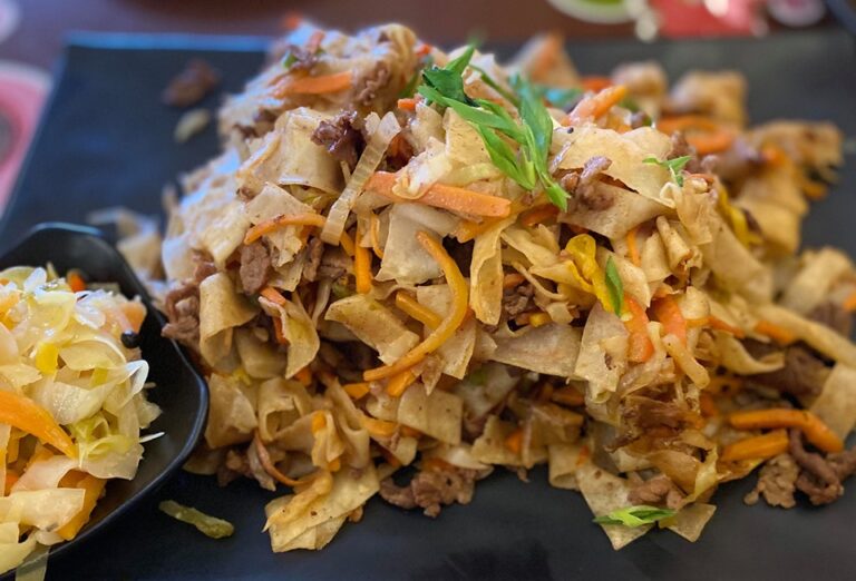 How is Mongolian cuisine influenced by its nomadic heritage?
