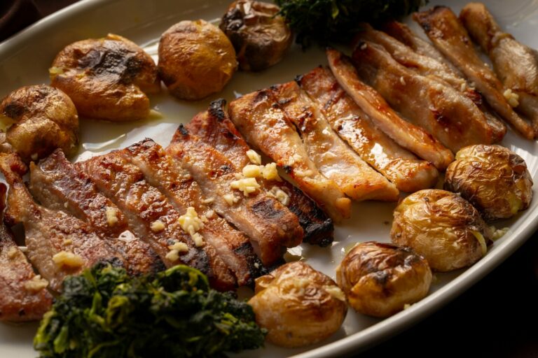 How has the country’s geographical location and historical context influenced Portuguese cuisine?